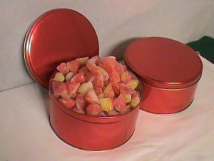 ROUND RED TIN OF PEACH BUDS CANDY